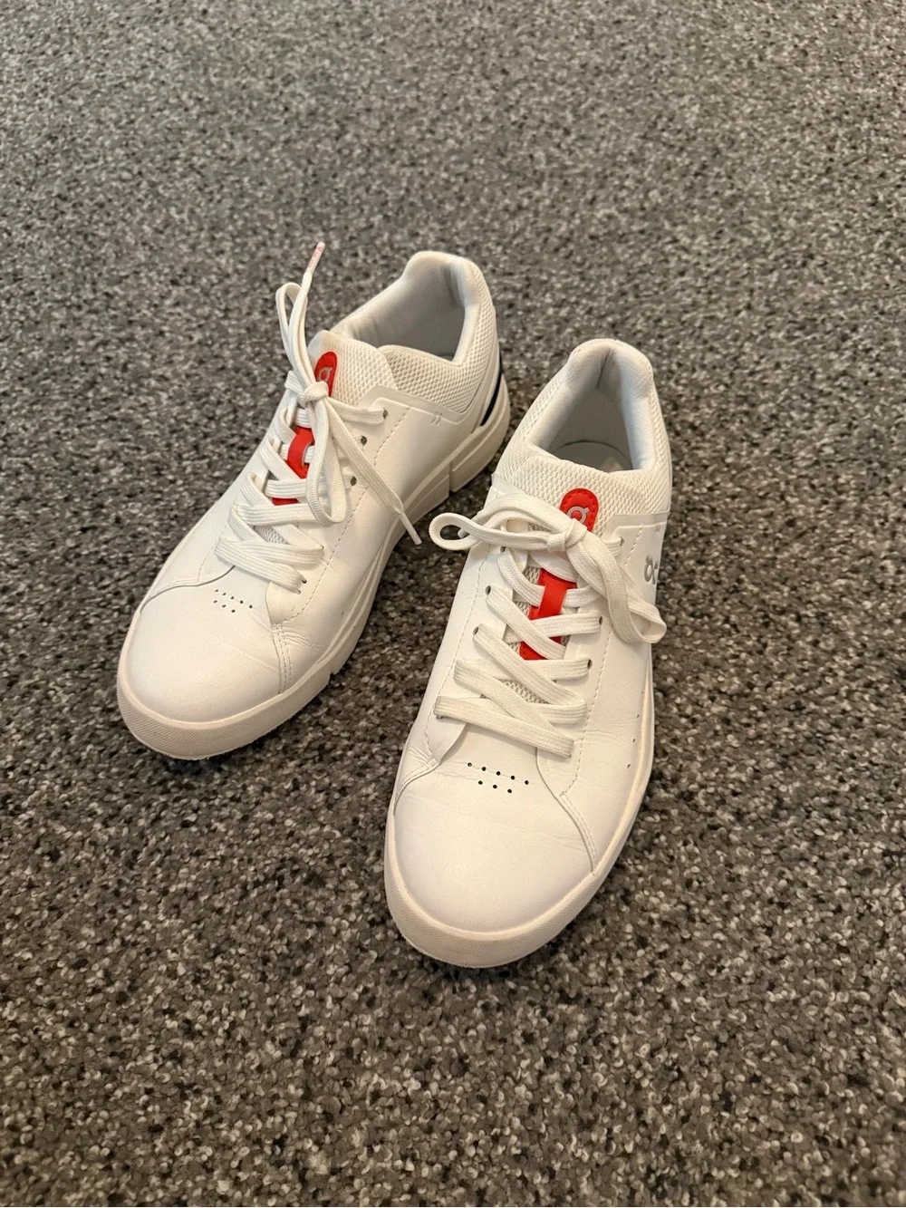 On Running White Sneakers with Red Accent